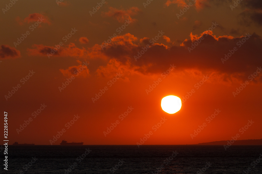 Distant Ferry at Sunset