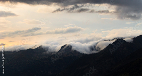Fototapeta Naklejka Na Ścianę i Meble -  Panoramic View of Clouds Surrounding the Mountains