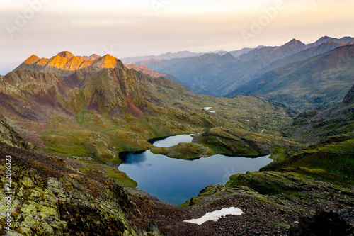 Panoramic View of Lake Amidst Mountains at Sunrise