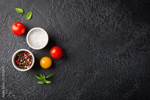 Red and yellow fresh tomatos, basil and olive oil