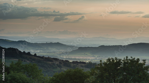 Beautiful dramatic Summer sunset landscape over English countryside with stunning light © veneratio