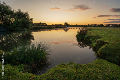 Fototapeta Naklejka Na Ścianę i Meble -  Beautiful dawn landscape image of River Thames at Lechlade-on-Thames in English Cotswolds countryside