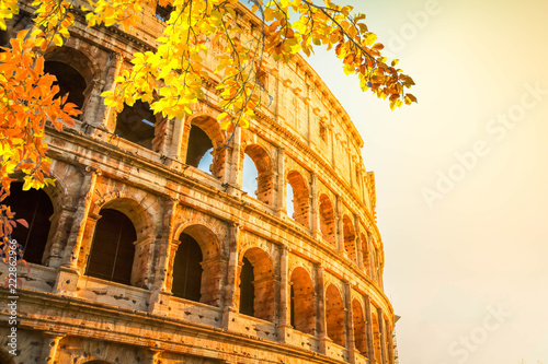 ruins of Colosseum at sunrise light in Rome, Italy at fall