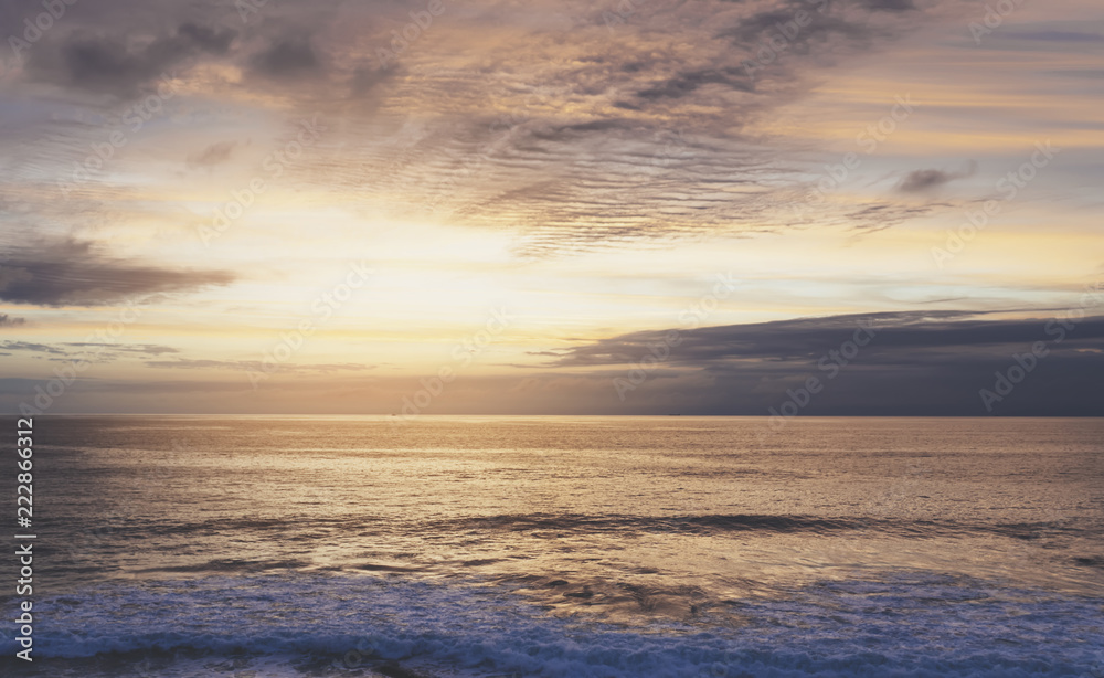 Sunlight sunset on horizon ocean on background seascape atmosphere rays sunrise. Relax view waves sea on evening sand beach, sun light flare nature evening outdoor vacation concept