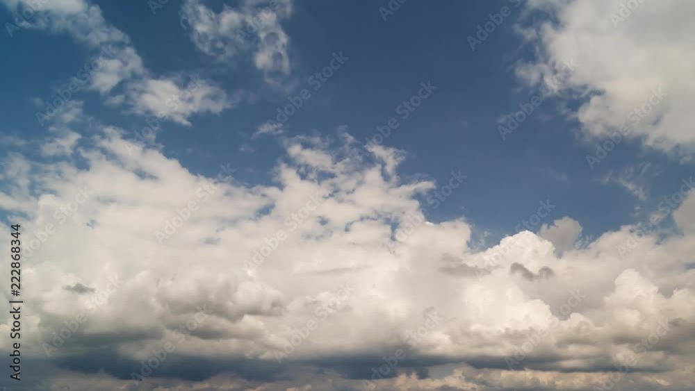 Timelapse white fluffy clouds on blue sky sunny day Timelapse white fluffy clouds on blue sky sunny day