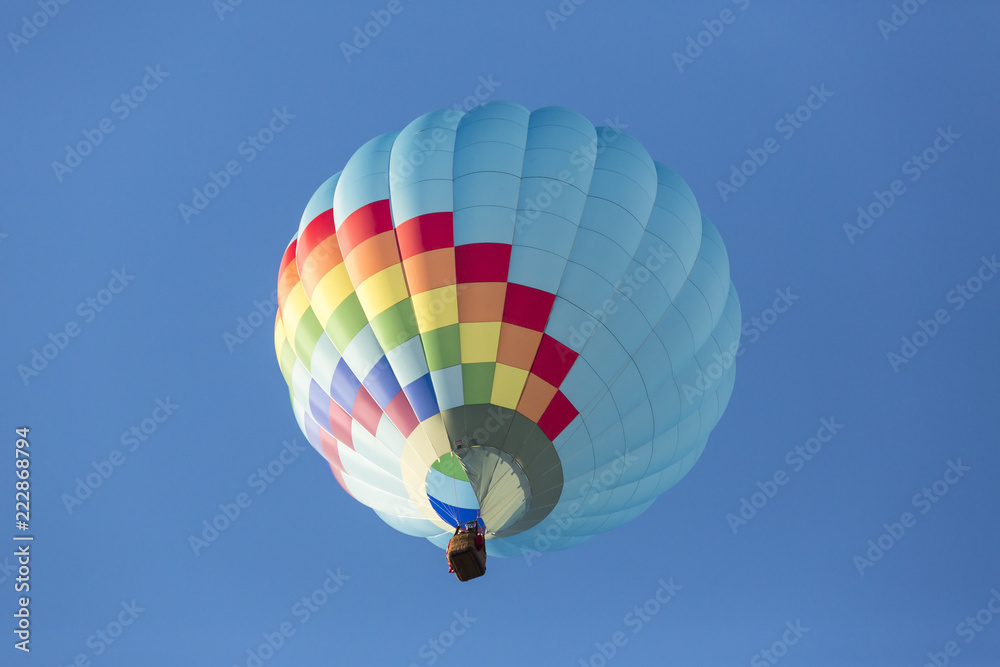 Naklejka premium Hot air balloons flying in a beautiful blue clear sky