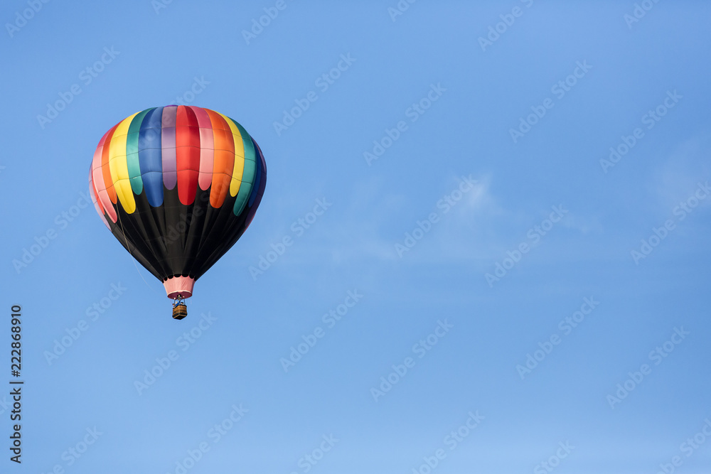 Hot air balloons flying in a beautiful blue clear sky Hot air balloons flying in a beautiful blue clear sky