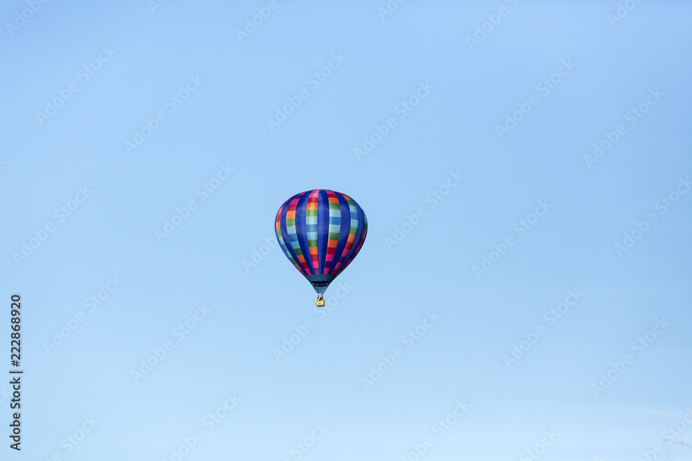 Hot air balloons flying in a beautiful blue clear sky Hot air balloons flying in a beautiful blue clear sky