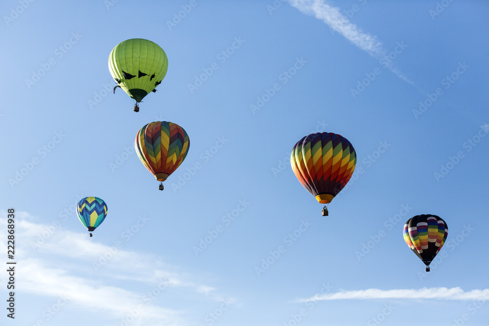 Hot air balloons flying in a beautiful blue clear sky