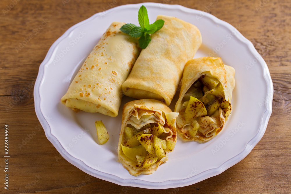 Apple cinnamon crepes. Pancakes with caramelized apples and cinnamon