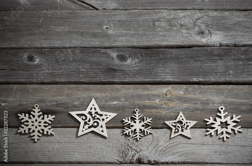 wooden snowflakes and srars on old dark background