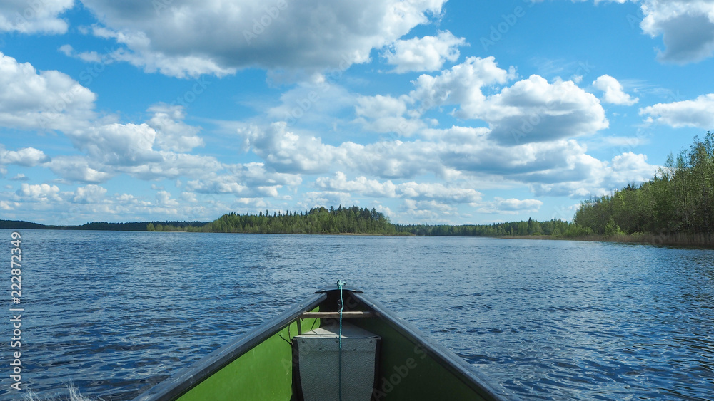 canoeing at finnish lake in summer
