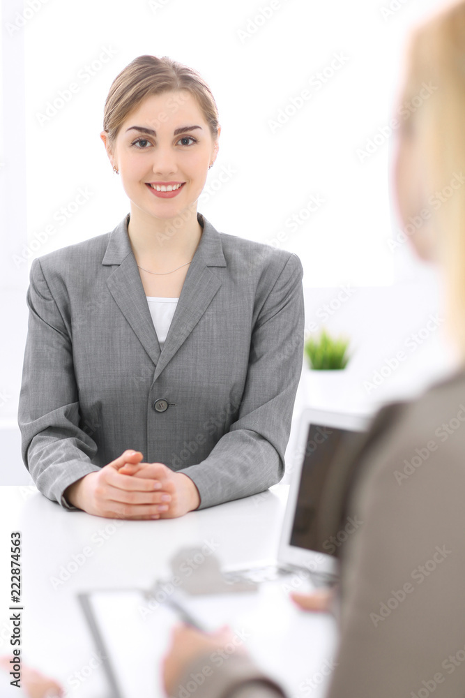 Group of business people working together in office. Focus on middle age women Group of business people working together in office. Focus on middle age women
