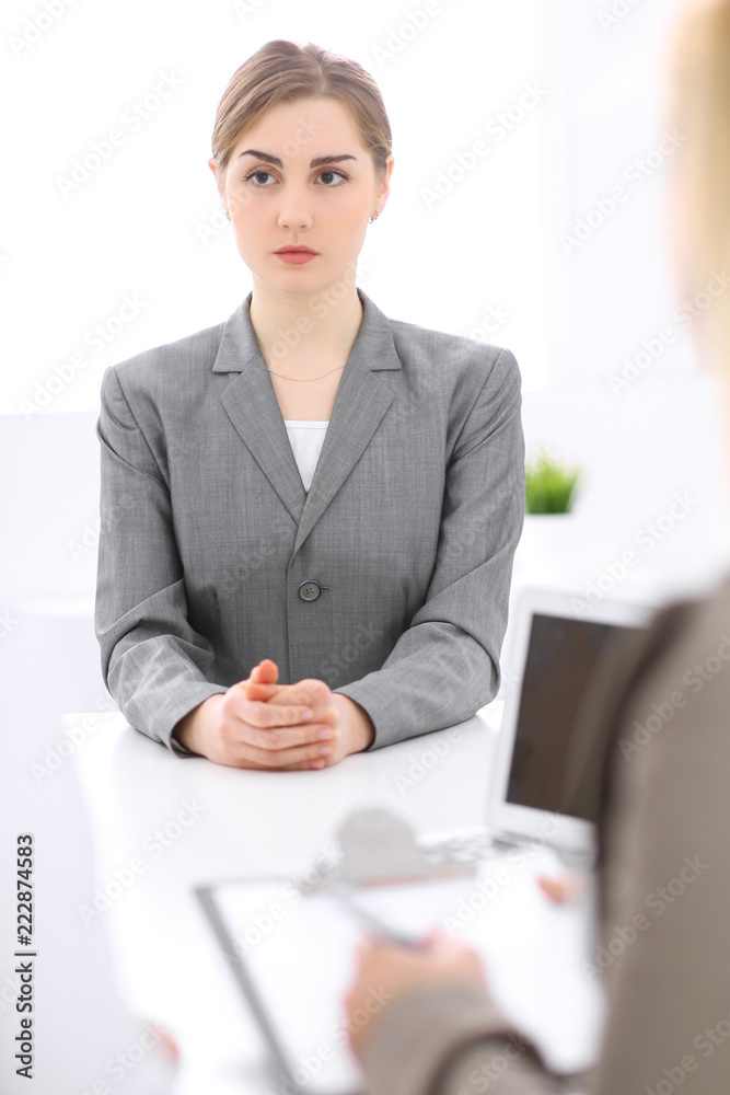 Group of business people working together in office. Focus on middle age women Group of business people working together in office. Focus on middle age women