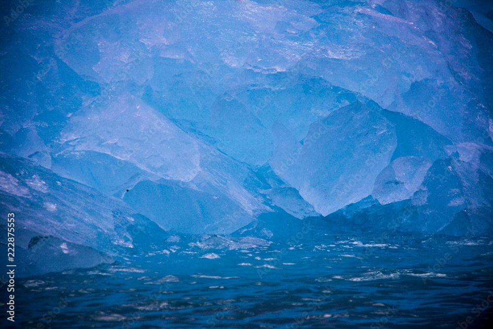 Close up of brilliant blue sea ice on the Svalbard archipelago in the Norwegian high arctic