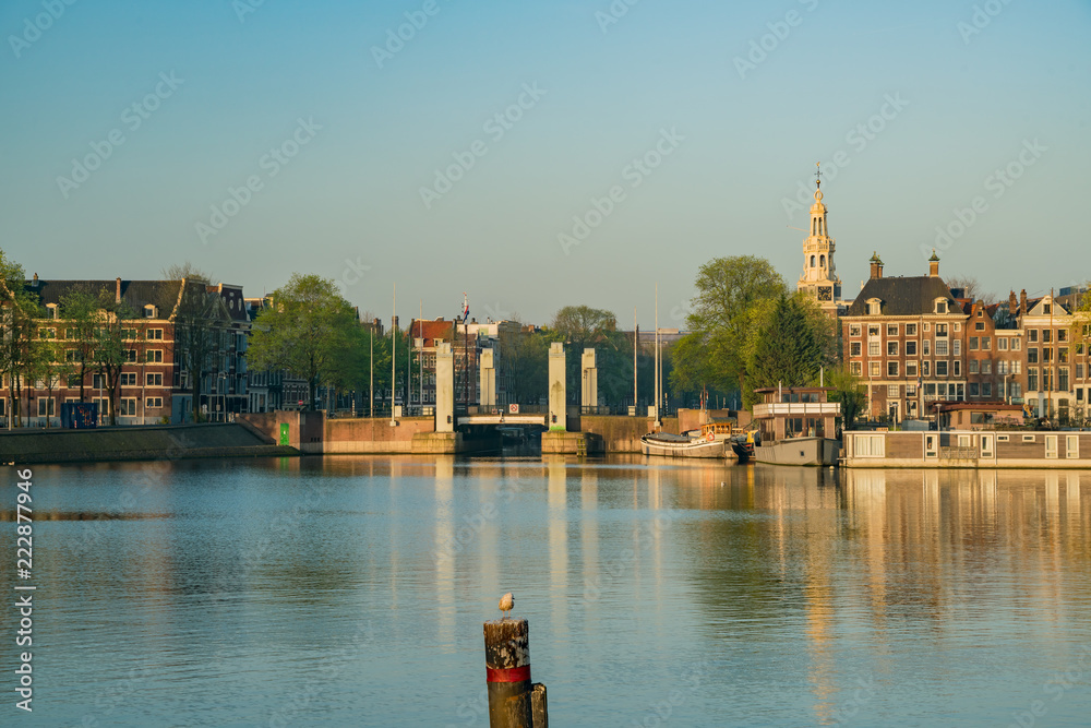 Morning view of the historical Montelbaanstoren Tower and cityscape