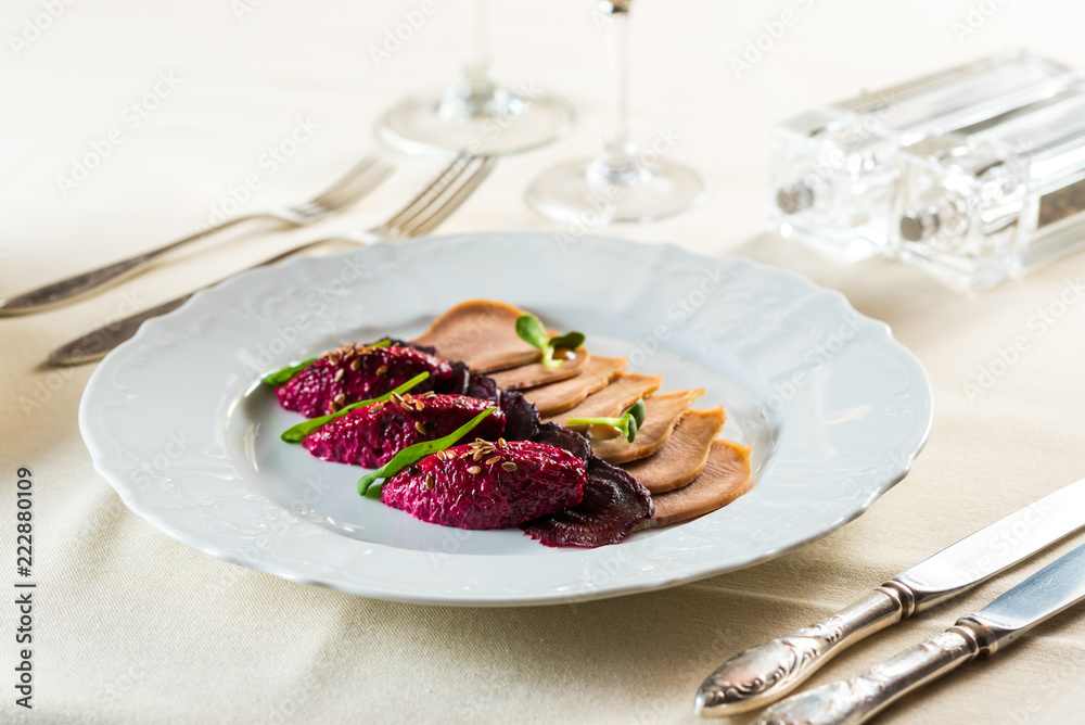 boiled sliced pork tongue with red food beetroot