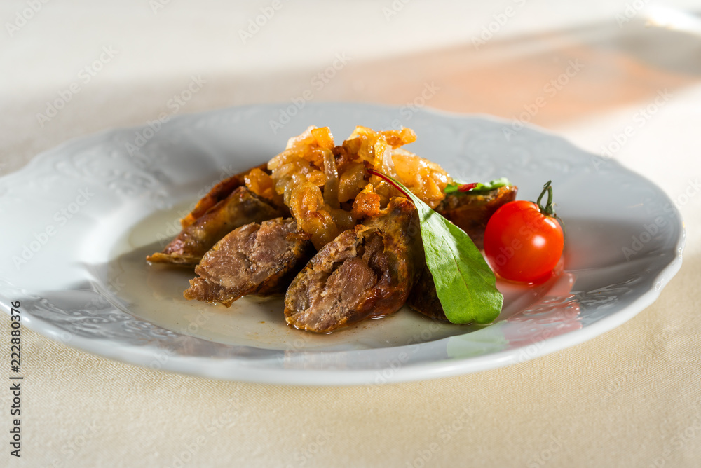 homemade smoked hot pork sausage with vegetables and fried onions