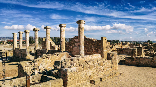 Ancient ruins of Kourion city near Pathos and Limassol, Cyprus. Row of columns under blue sky. Travel outdoor background