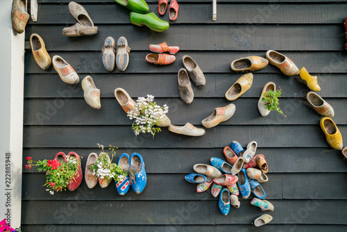 Wooden shoes hanging on the wall photo