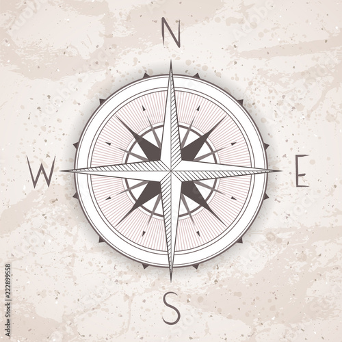 Vector illustration with a vintage compass or wind rose on grunge background. With basic directions North, East, South and West.