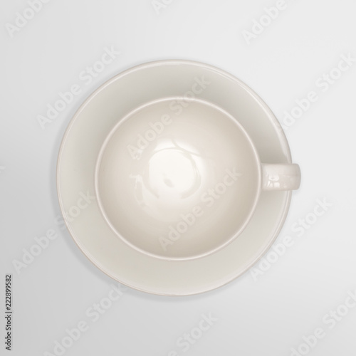 Top view-close up of a white cup on white background