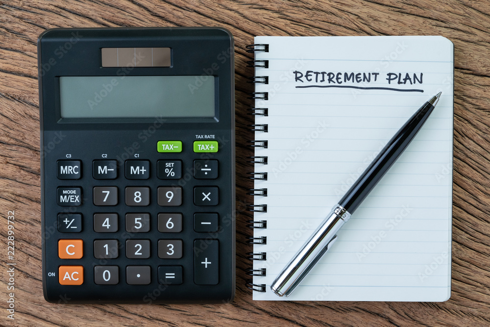 Retirement planning concept, calculator with empty notepad with pen and handwriting underline headline as Retirement Plan on wood table, plan of saving and investment for expense after retire life Retirement planning concept, calculator with empty notepad with pen and handwriting underline headline as Retirement Plan on wood table, plan of saving and investment for expense after retire life