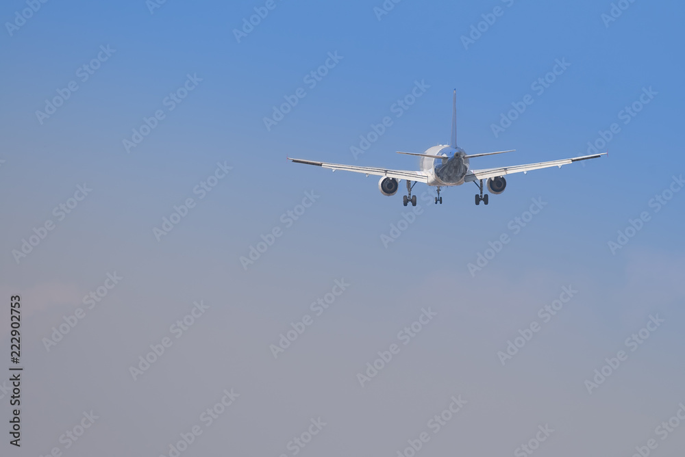 Big airplane flying with the land gear down Big airplane flying with the land gear down