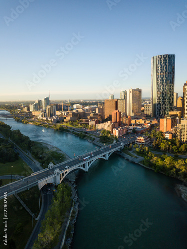 Aerial view of a beautiful modern cityscape during a vibrant sunny sunrise. Taken in Calgary Downtown, Alberta, Canada.