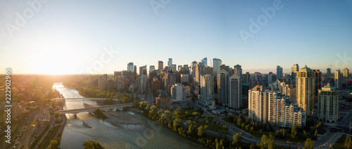 Aerial panoramic view of a beautiful modern cityscape during a vibrant sunny sunrise. Taken in Calgary Downtown, Alberta, Canada.