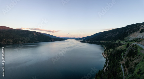 Aerial panoramic view of Kalamalka Lake during a vibrant summer sunset. Located near Kelowna and Vernon, BC, Canada.