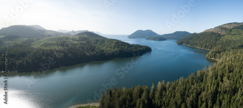 Aerial panoramic view of an Inlet near a small town, Winter Harbour, during a vibrant sunny summer day. Located in the Northern Vancouver Island, BC, Canada.