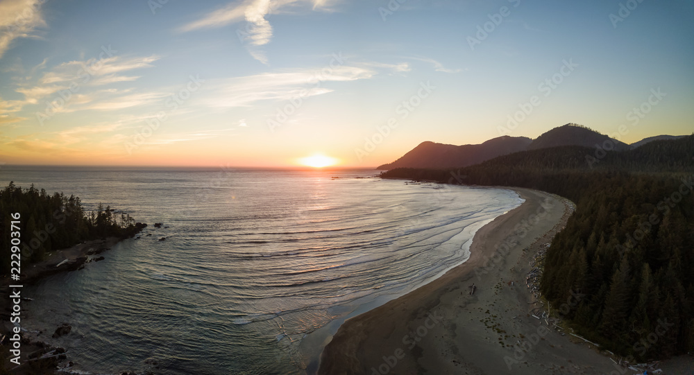 Aerial panoramic view of a beautiful beach on Pacific Ocean Coast druing a vibrant sunny summer sunset. Taken in Raft Cove Provincial Park, Nortern Vancouver Island, BC, Canada.