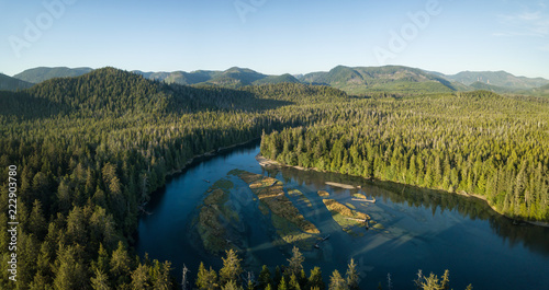 Aerial view of a beautiful river near the Pacific Ocean Coast druing a vibrant sunny summer sunset. Taken in Raft Cove Provincial Park, Nortern Vancouver Island, BC, Canada.