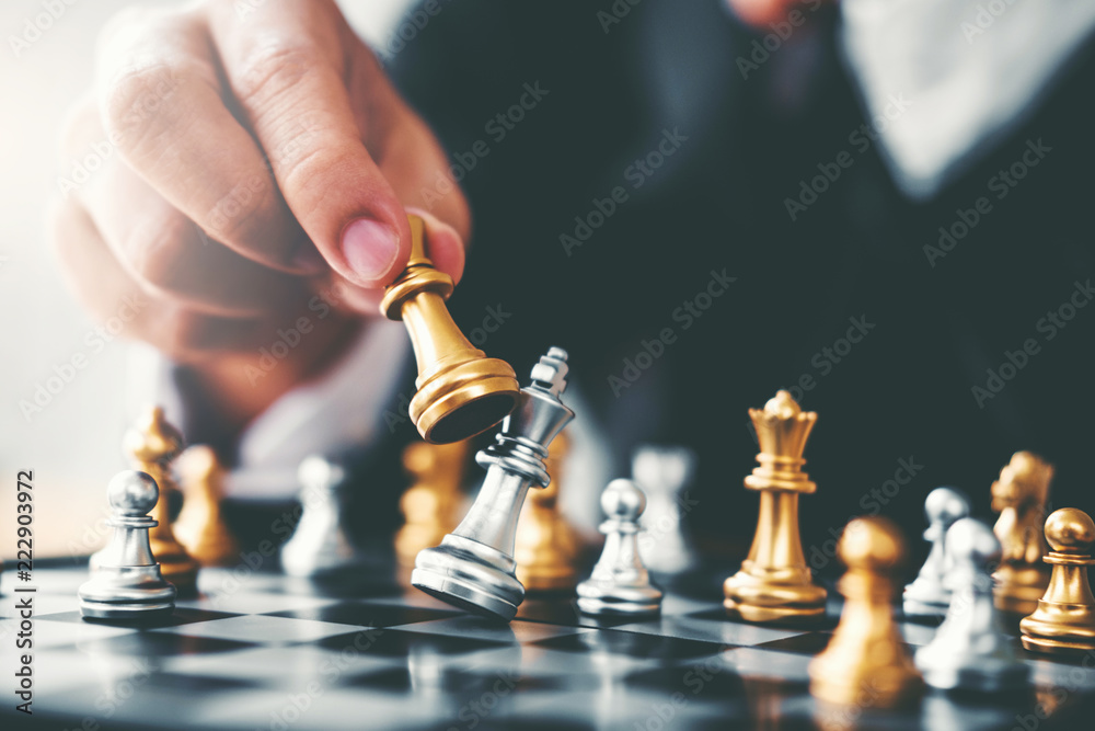 Businessman playing chess game Planning of leading strategy successful business leader concept - obrazy, fototapety, plakaty 