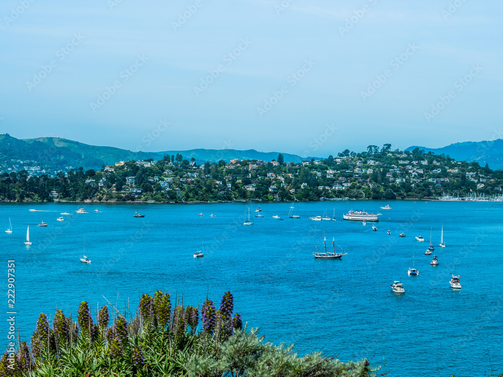 Boats and sailboats line up on the calm  blue waters to receive blessing on opening day of yachting season near Belvedere Tiburon in California.