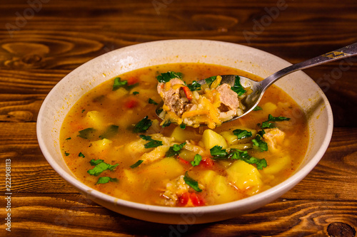 Georgian traditional food soup kharcho on wooden table