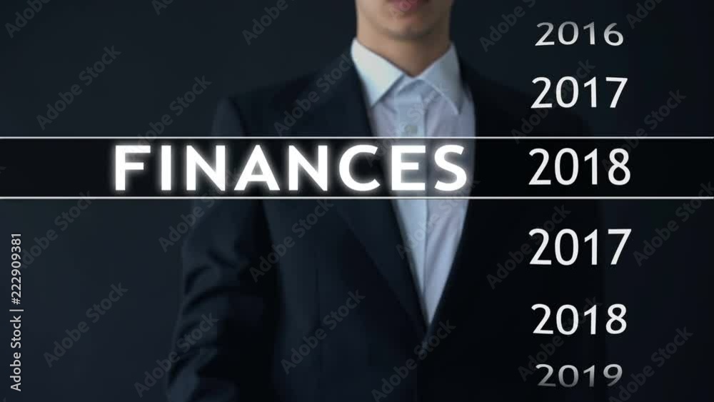 Businessman selects 2018 finances report on virtual screen, money statistics Businessman selects 2018 finances report on virtual screen, money statistics
