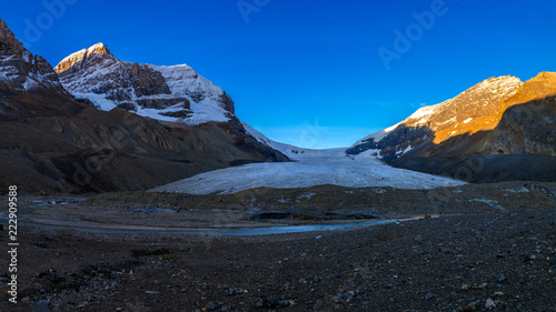 Scenic view of the sunrise over the Athabasca Glacier in the Jasper National Park, Alberta, Canada