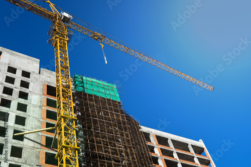 tower crane at the construction site of a residential building