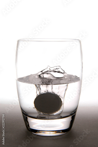 Glass with alka seltzer photo