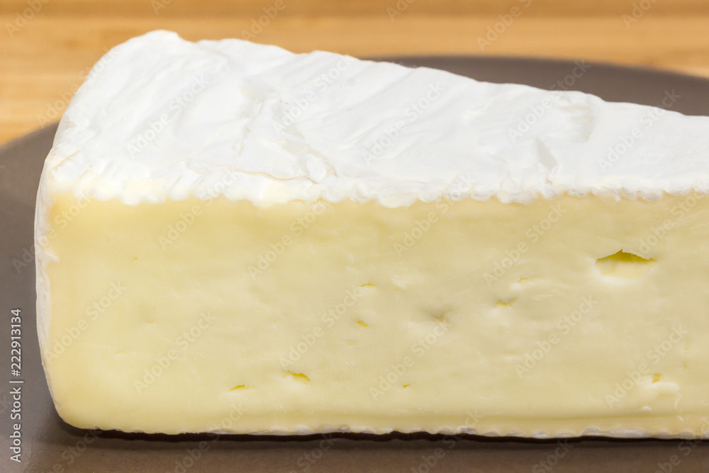 Brie cheese cut of close-up