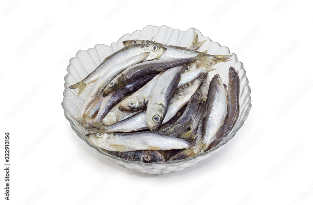 Defrosted uncooked baltic herring in the glass bowl Defrosted uncooked baltic herring in the glass bowl