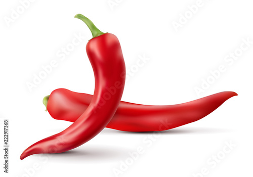 Two red chilli peppers with shadows isolated on white background