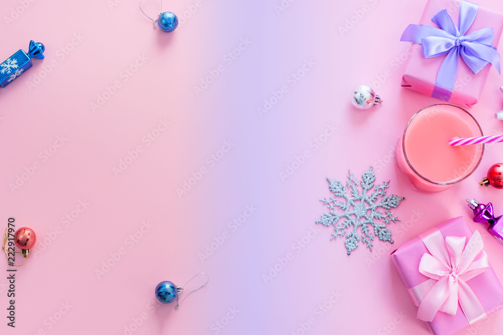Festive background for text composition flat lay Christmas items gift box ribbon bow pink glass cocktail Christmas toys Top view copy space