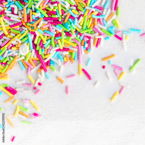 Sugar sprinkles on a white background as decoration for cake and bakery. 