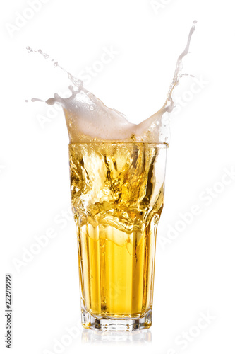 Cold beer splash out of glass isolated on white background.