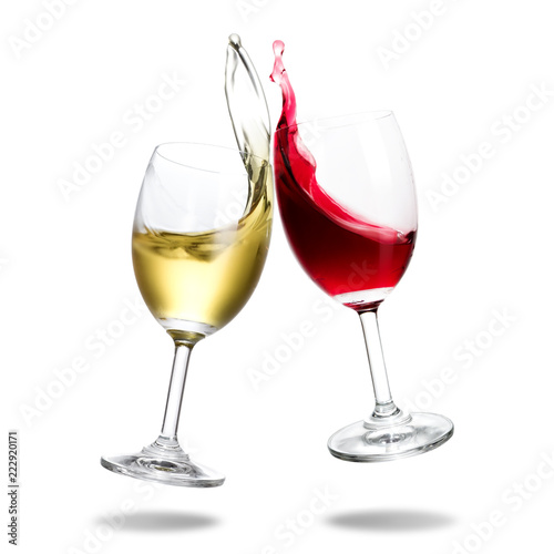 Cheers wine with splash out of glass isolated on white background.