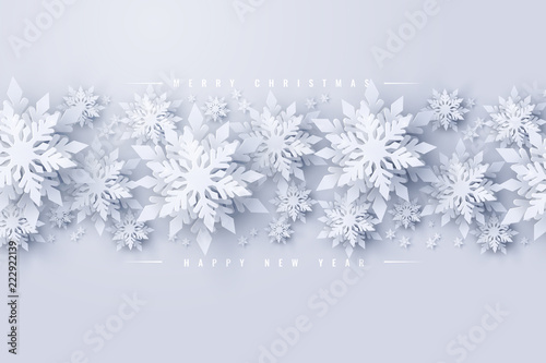 Vector Merry Christmas and Happy New Year background with realistic looking paper cut snowflakes. Seasonal Christmas and New Year holidays greeting card