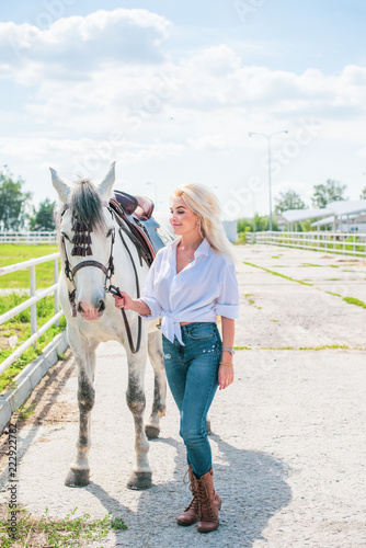 Woman hugging her horse - Concept about love between people and animals . Beautiful lady lifestyle with best friend horse in countryside. Portrait of human and animals for pet life concept outdoor 